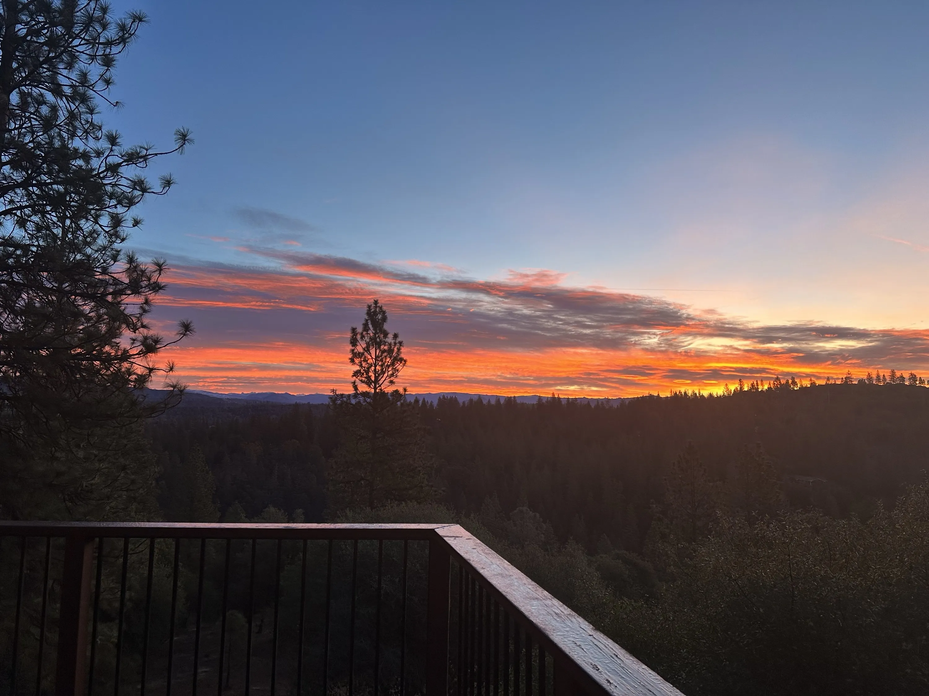 Sunset over layered ridges from the deck